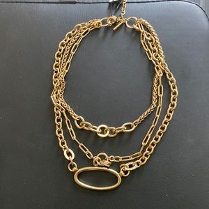 Gold necklace with tags